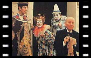 Image of The Celestial Toymaker (Michael Gough), Clara (Carmen Silver), Joey (Campbell Singer), and The Doctor 
