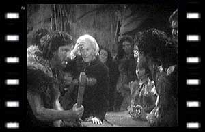 Image of The Doctor, Za (Derek Newark), and members of the tribe