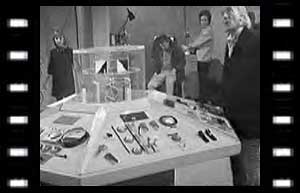 Image of Vicki, Ian, Barbara, and The Doctor around TARDIS console
