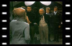 Image of Doctor, Susan, Ian and the first full view of a Dalek