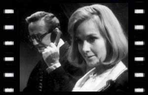 Image of Commandant (Colin Gordon) and Jean Rock (Wanda Ventham)