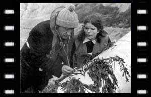 Image of Victoria, and The Doctor with a bomb on the Beach