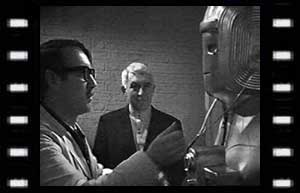 Image of Gregory (Ian Fairbairn), & Tobias Vaughn (Kevin Stoney) experiment with Cyberman 