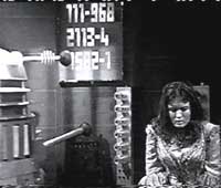 Image of a Dalek interrogating Victoria 