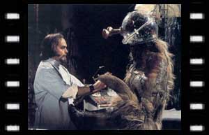 Image of Dr. Mehendri Solon (Philip Madoc), and his monster (Stuart Fell)