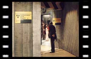 Image of The Doctor, Sarah Jane and Professor Watson (Glyn Houston) in the hallway at the Nuclear Plant