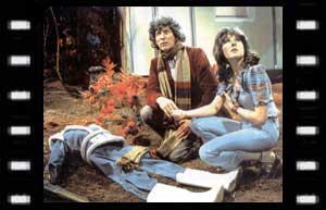 Image of the Doctor and Sarah Jane examining a 'dead body'