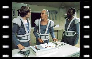 Image of Controller Salamar (Prentis Hancock), Vishinsky (Ewen Solon) and De Haan (Graham Weston)