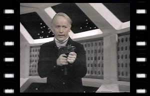 Image of Kellman (Jeremy Wilkin) with gun