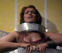 Image of Leela restrained