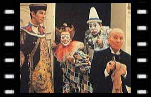 Image of The Celestial Toymaker (Michael Gough), Clara (Carmen Silver), Joey (Campbell Singer), and The Doctor
